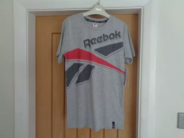 New with tags Boys Reebok grey t-shirt with blue & red Design size M  11-12 yrs