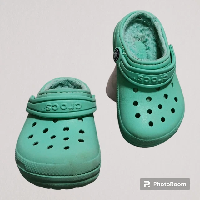 Teal crocs deals with fur