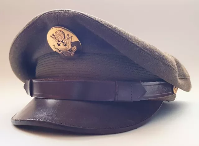 7 Military peaked visor caps , one WW2 U.S others post war as one lot.