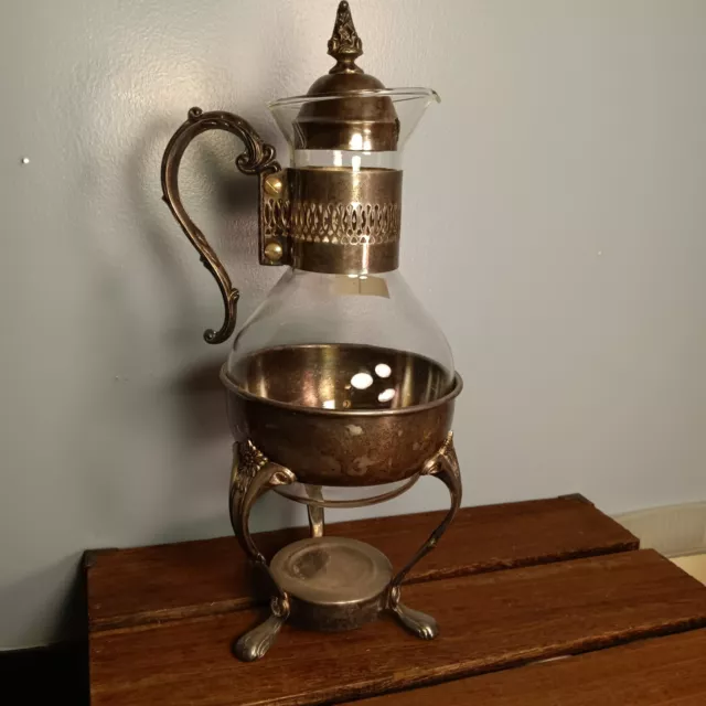 https://www.picclickimg.com/JEkAAOSwAFZlEH9b/Vintage-Raimond-Silver-plate-Coffee-Tea-Carafe-Warming.webp