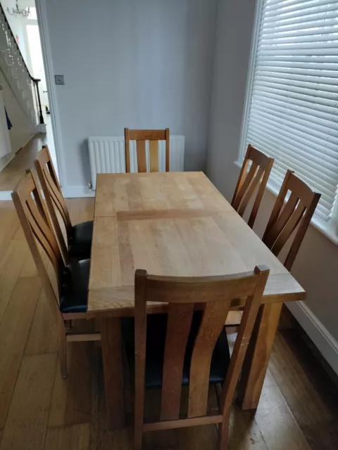 extending solid oak dining table and 6 chairs