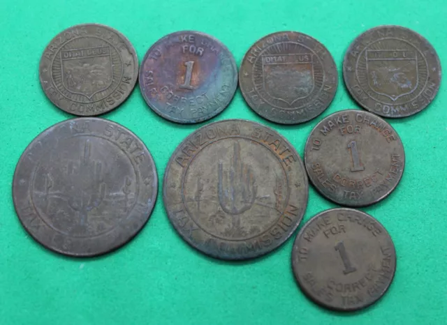Eight Arizona tax tokens - 6 one cent & 2 five cents