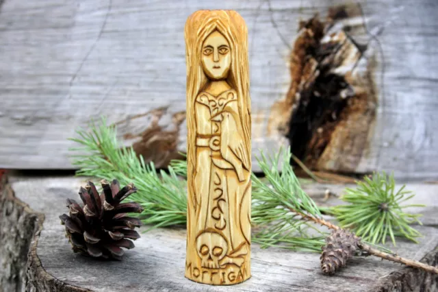 Small wooden statue of Morrigan.Celtic Goddess Morrigan