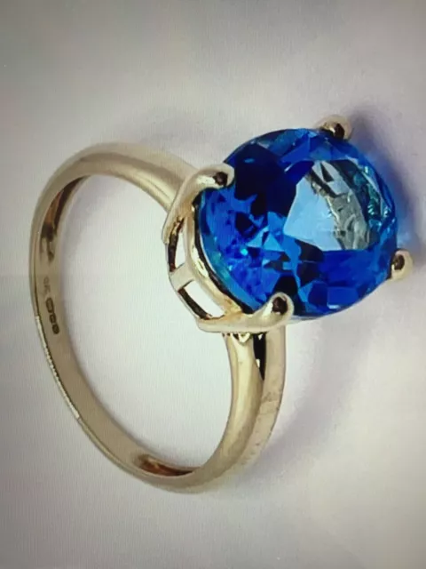 Beautiful Very Large, Blue Topaz Solitaire Ring, set in 9ct Yellow Gold.