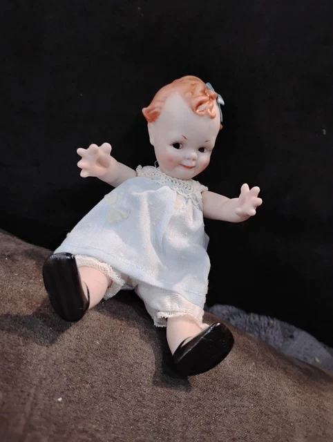 Poupée de porcelaine - Label Emmaüs