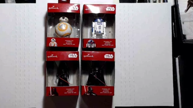 Four hallmark star wars christmas ornaments (never opened) still in boxes