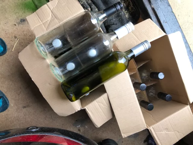 12 empty wine bottles - same vineyard