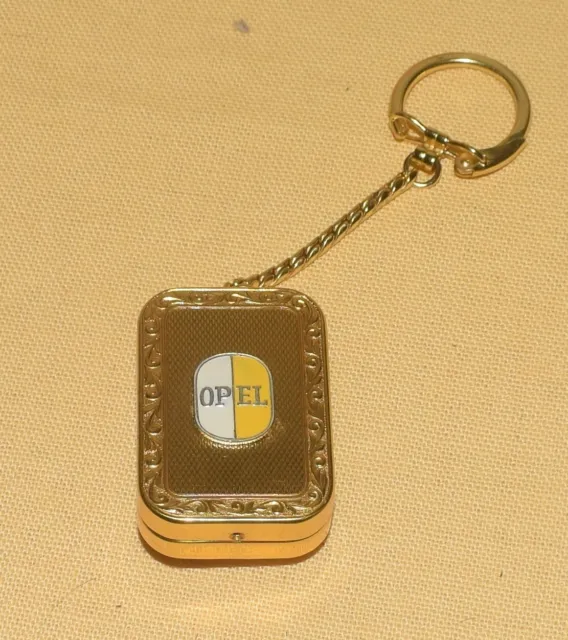 Reuge Spieluhr Schlüsselanhänger Logo  Adam Opel AG