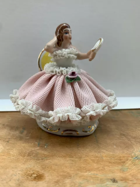 Dresden lace figurine 'Lady in Pink Sitting'. Perfect condition. 8cm high.