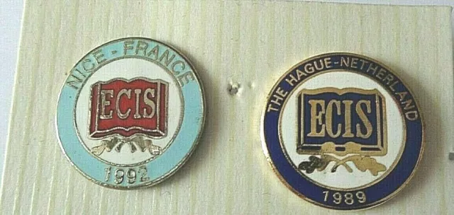 Two E C I S Enamel Lapel  Badges