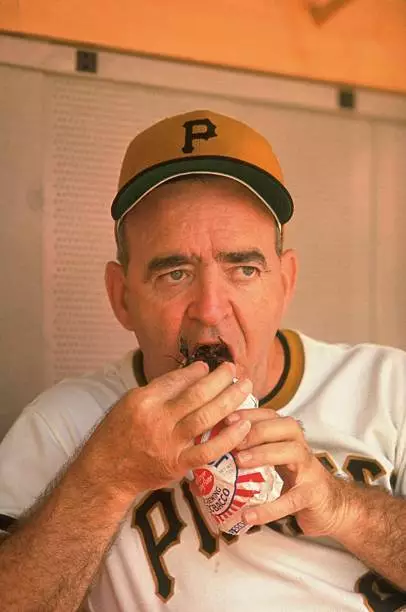 Closeup of Pittsburgh Pirates manager Danny Murtaugh putting chewi - Old Photo