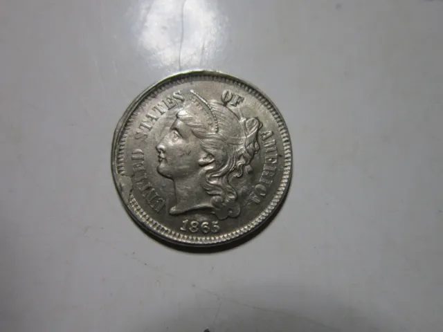 1865 (cud on obverse) Three Cent Nickel