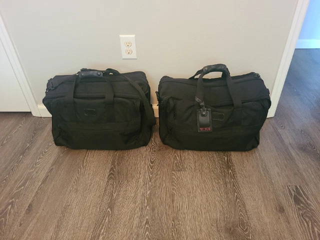 Two TUMI 21"×12"×8" BALLISTIC BLACK NYLON BAGS