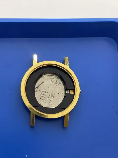 Movado Case 87 25 832 gold tone With Movement Holder, No Crystal.