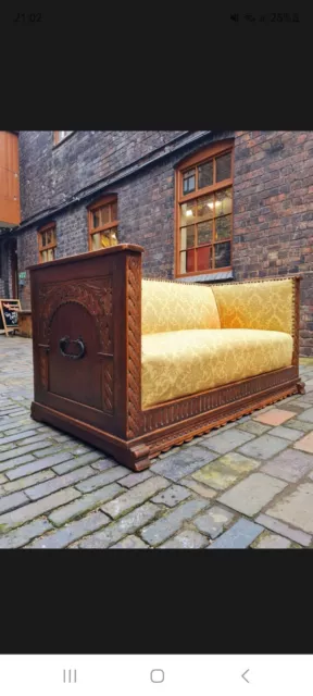 Antique heavily carved solid oak settee