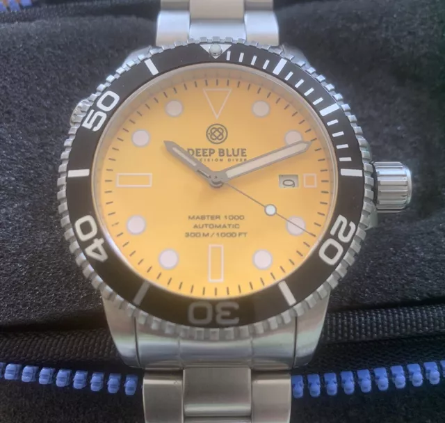 Deep Blue Master 1000, full-lume arancio, mov. NH35, 30 Atm., 44 mm., valv. elio