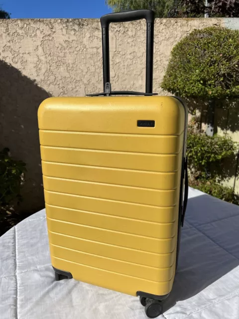 AWAY Luggage The Carry-On Limited Yellow Gray Rolling Hardshell spinner suitcase