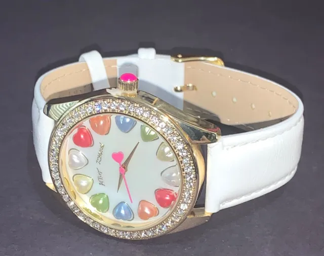 Betsey Johnson mother of pearl hearts dial rhinestone bezel white strap watch