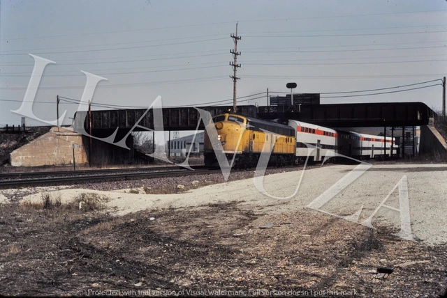 Original Slide CNW E-8 w/ RTA cars at Bellwood IL Feb 1983