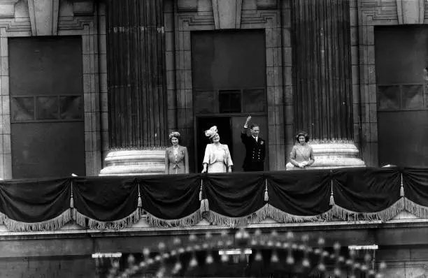 King George VI waves from the balcony of Buckingham Palace as - 1945 Old Photo