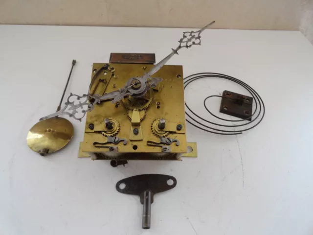 Ancien mécanisme de pendule horloge oeil de boeuf  fonctionne pièces détachées