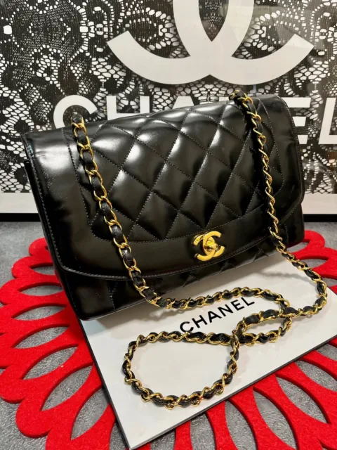 CHANEL MINI FLAP BAG, black patent leather with silver tone hardware,  shoulder chain interwoven with patent leather, leather lining, authenticity  card and inside sticker 2012-2013, two internal pockets, 17cm x 11cm.