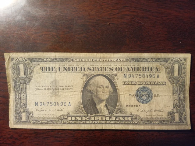 1957 A silver certificate 1 blue seal dollar bill N94750496A