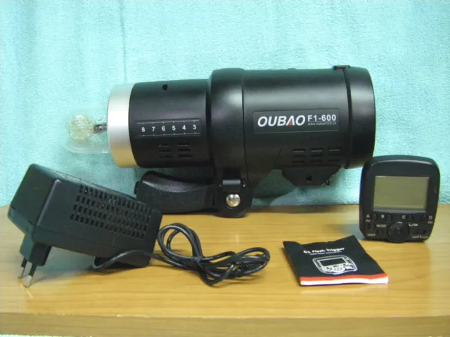 Flash de estudio portatil OUBAO TRIOPO F1-600 y disparador G1 para camara fotos.