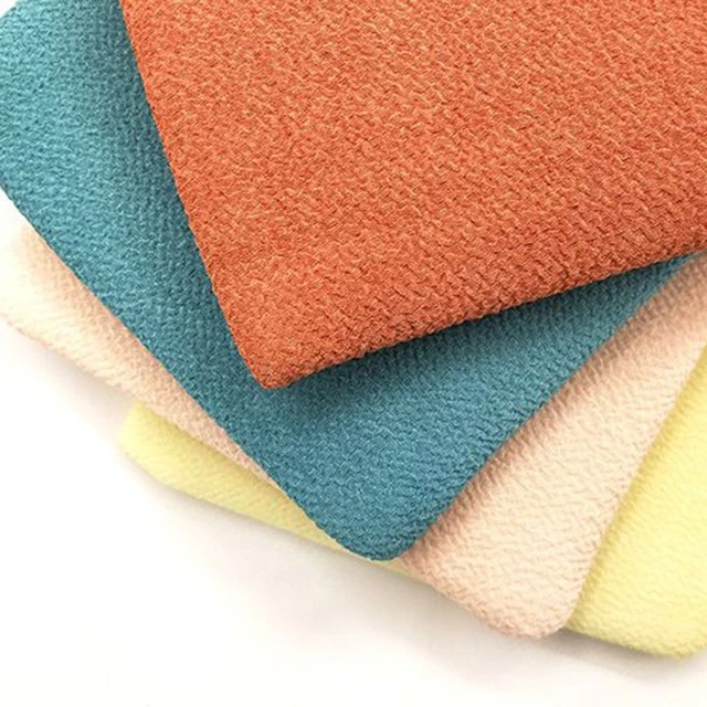 Guantes exfoliantes suaves para la eliminación efectiva del cuerpo y la piel de color marrón claro