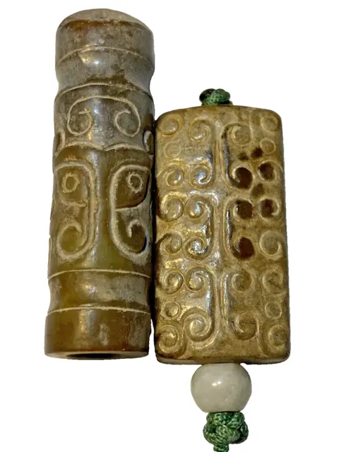 Two Chinese Caledon Jade Pendants, Chou Period, 1046-256 Bc.