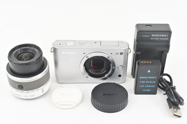 Cámara sin espejo Nikon 1 J1 de 10,1 MP plateada con lente VR de 10-30 mm,...