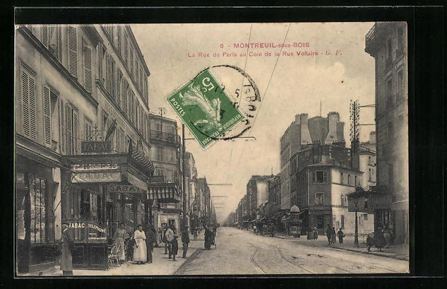 CPA Montreuil-sous-Bois, La Rue de Paris au Coin de la Rue Voltaire