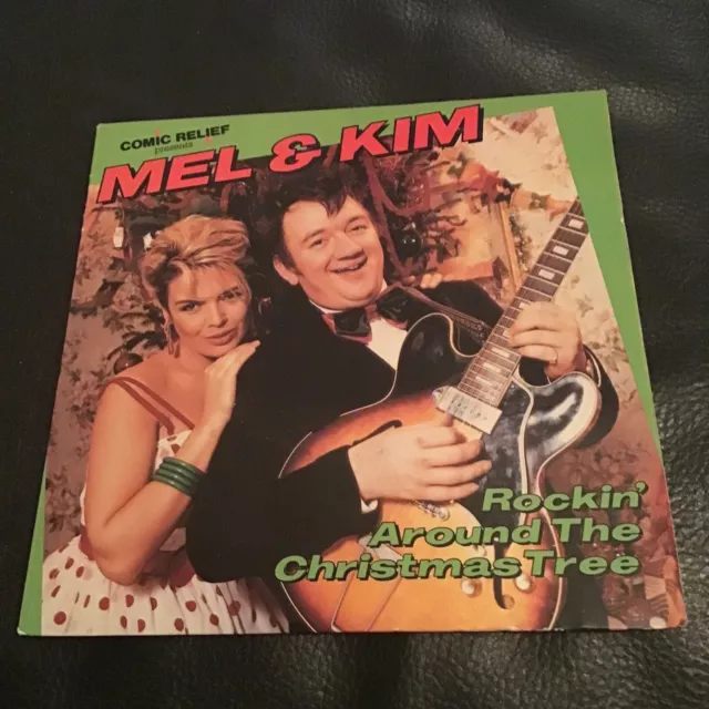 Mel and kim rockin cheap around the christmas tree