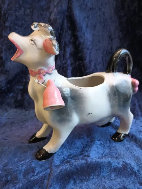 Vintage Porcelain Cow Creamer With Pink Bell And A Bow On The Tail