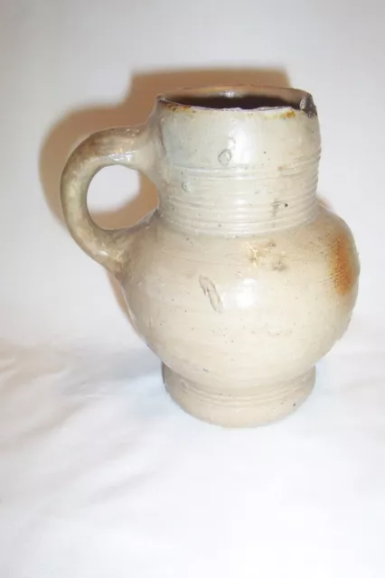 Raeren stoneware drinking mug c. 16th century.     Bellarmine krug