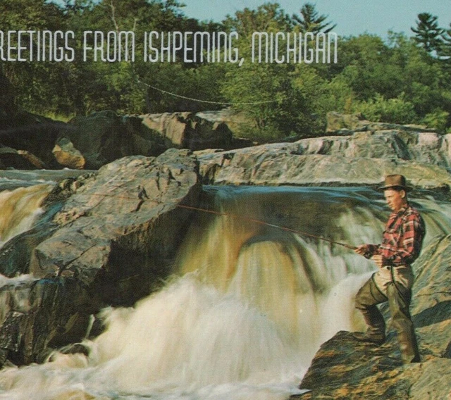 Greetings from Ishpeming Michigan man fishing falls c1960s postcard D135