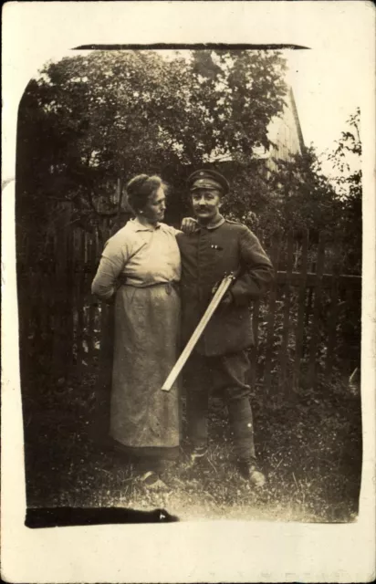 WWI German soldier with wife and double barrel shotgun ~ RPPC real photo