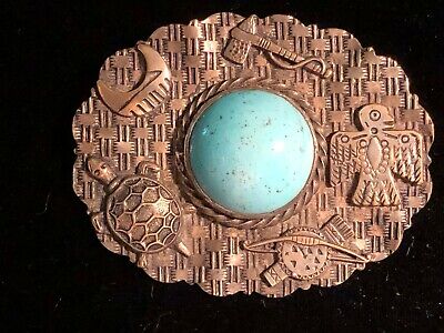 Depression era large brass and silver wash fake Indian pin with blue glass