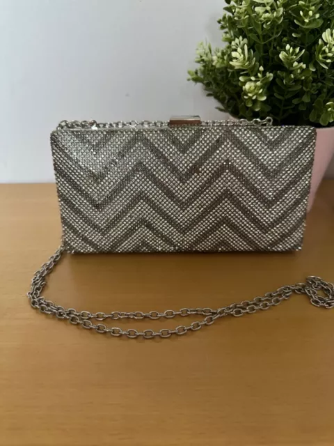 Mario valentino best sale clutch