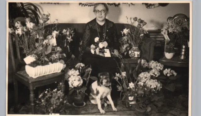OLDER WOMAN SURROUNDED BY FLOWERS, jack russell terrier real photo postcard rppc