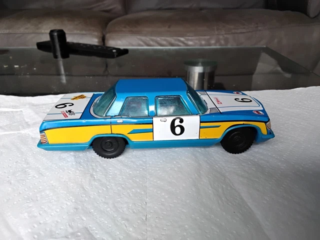 Ancien jouet voiture en tôle - Le Brocanteur du Dimanche