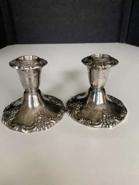 https://www.picclickimg.com/Kb0AAOSwIR1giDJU/Baroque-by-Wallace-Pair-of-Silverplate-Low-Candle.webp
