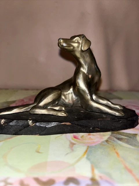 brass greyhound dog figurine. 5x3 pretty dog. we have had him over 45 years.