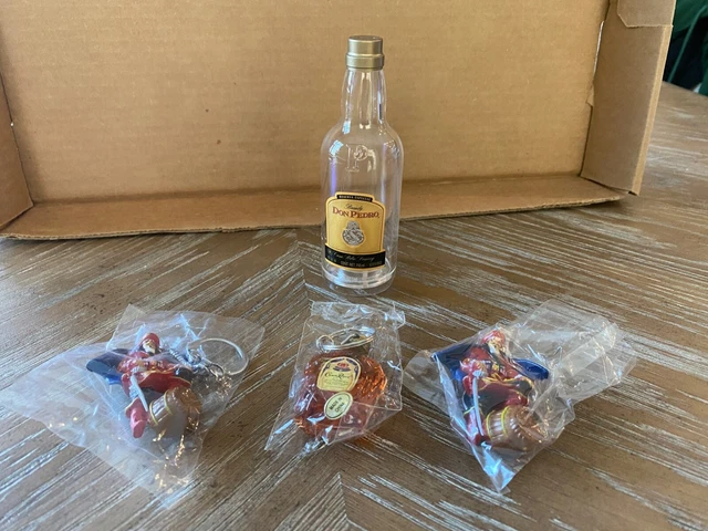 1-Crown Royal, 2- Captain Morgan keychains & 1-Don Pedro pepper shaker. NR Aucti
