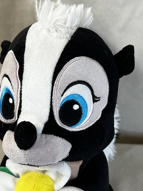 Skunk Rocker Plush DISNEY STORE BAMBI FLOWER THE SKUNK Plush Holding White Flower 9 ...
