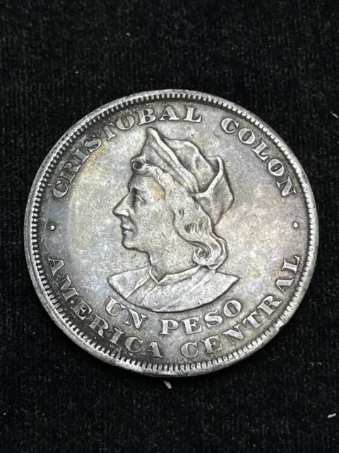 1894 El Salvador Un Peso KM115.1  Cristobal Colon Silver