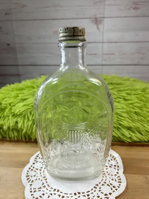 Vintage log cabin syrup Clear glass bottle 1976 approx 8.5" Tall Screw on Lid