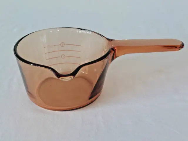 https://www.picclickimg.com/KoAAAOSwvhdlluF-/Vintage-VISION-Amber-Corning-Ware-7L-Glass-Cookware.webp