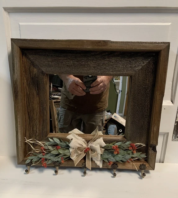 Entryway Barn Wood Mirror with hooks, Bow & Floral Arrangement.  17” X 16”.