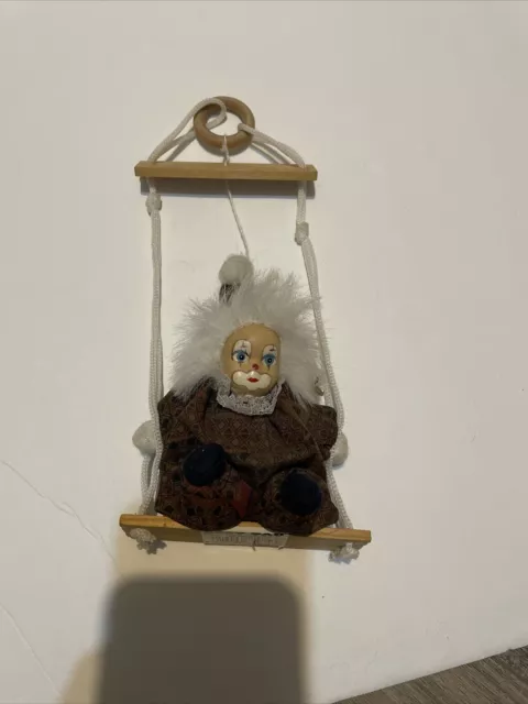 VINTAGE LIDCO PORCELAIN FACED CLOWN ON A WOODEN HANGING SWING. Marionette Brown